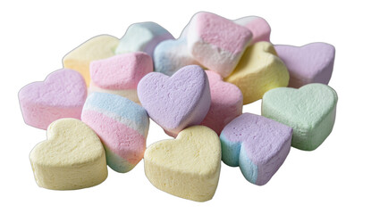A pile of pastel-colored heart-shaped candies on a black background