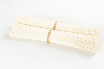 Handmade Dried Pasta Bundle with Twine on White Background