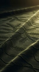 Abstract textured fabric with subtle light and shadow play.