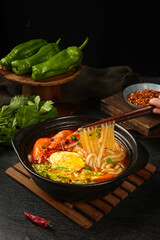 Hot Chinese Noodle Soup with Fresh Shrimp and Egg in Casserole