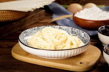 Fresh Cooked Noodles with Ingredients on Wooden Surface
