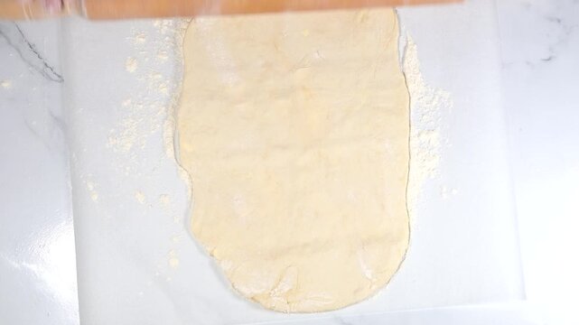 woman with roller pin working with dough
