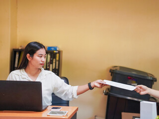 Businesswoman using phone laptop browsing internet goal planning new beginnings remote work workplace. Young professionals meeting collaboration brainstorming in office. Female leadership use AI chat