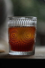 Freshly brewed pour-over coffee in a patterned glass
