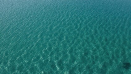 Obraz premium Crystal Clear Turquoise Water Surface Ripples Abstract Background.