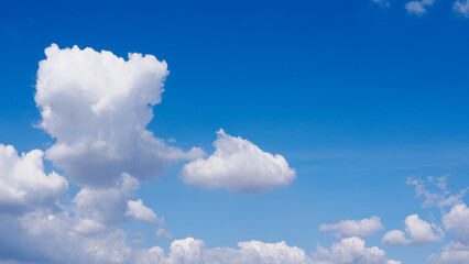 Bright Blue Sky Background with Fluffy White Cumulus Clouds