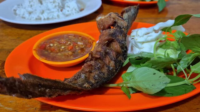 catfish or ikan lele and sambal, indonesian food, Popular Street Food Called Pecel Lele Lamongan or Penyetan Lele.