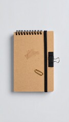 Top-down view of a small notepad with accessories