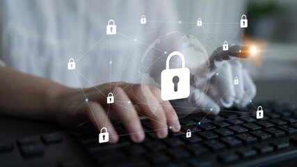 A close-up image depicting a hand typing on a keyboard with digital locks symbolizing online security and data protection in today technology-driven world. Gantry