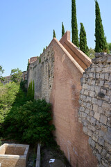 Roman wall of Girona surrounded by trees