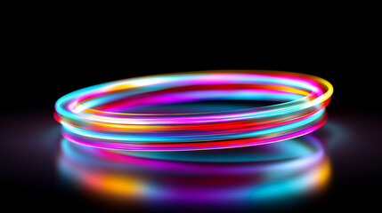 Abstract neon light trails in pink, blue and orange form dynamic circular motion on a dark background.

