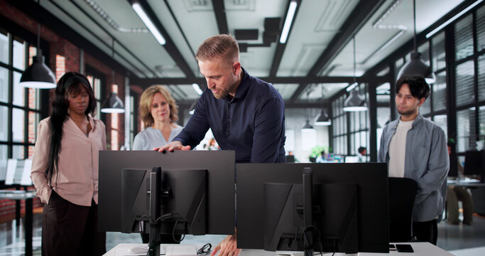 Fototapeta Office Trainer Demonstrating Proper Desk Ergonomics And Adjusting Screen
