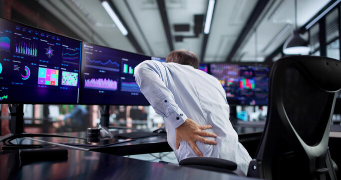 Office Worker Struggling With Back Pain