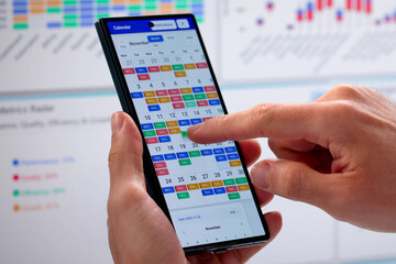 Mid-Age Caucasian Man Using Online Calendar