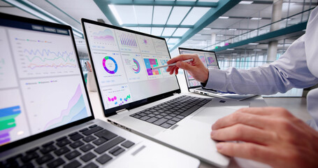 Businessman Analyzing Market Data On Office Computer Screen