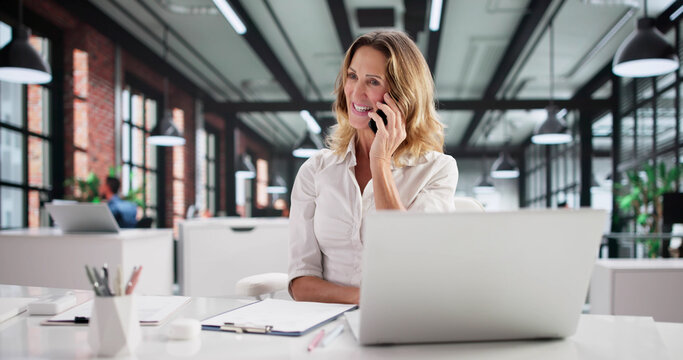 Smiling Executive Providing Training To Customer Service Representative - Powered by Adobe