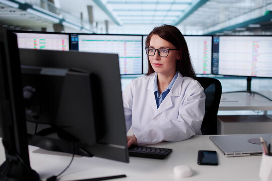 Hospital Billing Manager Reviews Coding Data On Multiple Screens Online - Powered by Adobe
