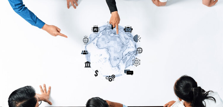 A diverse business team engages in collaboration over a map, pointing at technology and finance icons, illustrating strategic planning for future growth and innovation. Trope