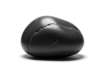 Smooth, dark river stone rests on a clean white background with soft shadow detail