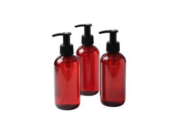 Three red plastic bottles with black pump dispensers