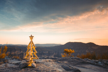 Christmas tree fairy lights in the mountains with sunrise sky.  Christmas in Blue Mountains.