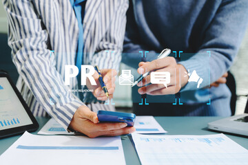 PR, Public relations concept. hands using laptop and tablet with public relations icon for communication advertising marketing strategy. with Ads and sales