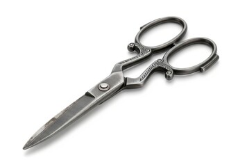 Antique style ornate metal cutting implement rests diagonally on a clean white surface