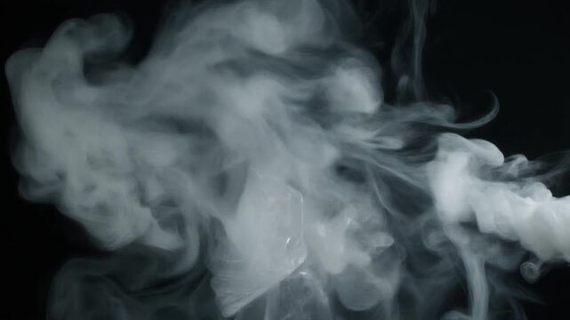 Slow dissipation of translucent, slightly opaque white smoke that has the texture of recycle