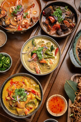 mix of traditional thai curries on restaurant table in phuket thailand