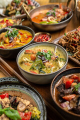 mix of traditional thai curries on restaurant table in phuket thailand