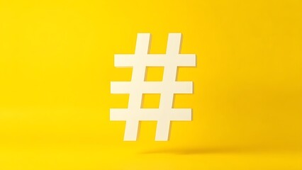 hashtag. A large white geometric hashtag symbol floating against a vibrant yellow background, representing modern marketing concepts. pitch deck slides.