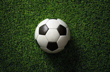 Fototapeta premium Soccer football on green grass field sport game concept