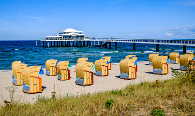 Beachside cabins lined on a sunny day showcasing vibrant colors and clear skies in a coastal location