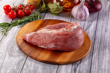 Raw pork sirloing over board