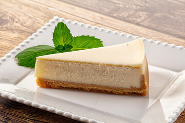 Classic delicous cheesecake slice served mint