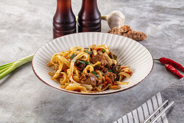 Asian cuisine udon with chicken and vegetables