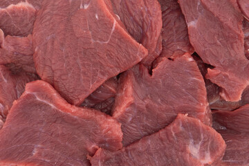 Raw fresh beef meat. Fresh raw sliced meat beef strips stroganoff isolated on white background.