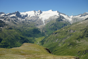 Fototapeta premium Grossvenediger massif glacier alpine scenery sunny summer day blue sky Matrei in Osttirol Austria