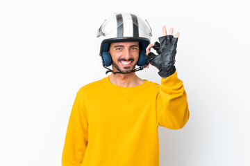 Fototapeta premium Young caucasian man with a motorcycle helmet isolated on white background showing ok sign with fingers