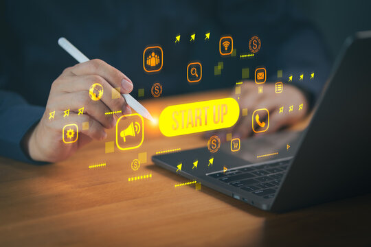 Person using a digital pen and laptop with startup icons, representing innovation, entrepreneurship, digital marketing, business development, online strategy, and modern technology-driven startups.