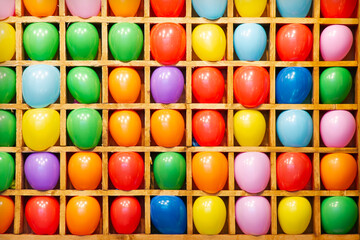 Balloon shooting gallery. Bright balls standing in a row