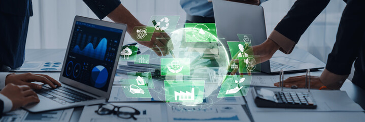Dynamic business professionals collaborating at a modern office, utilizing digital tools for strategic planning and data analysis to drive innovation and success. Trope