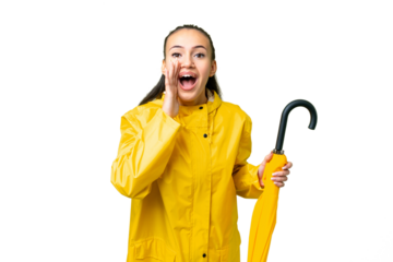 Young Arabian woman with rainproof coat and umbrella over isolated chroma key background shouting with mouth wide open