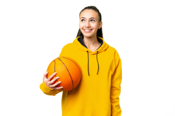 Young Arabian woman playing basketball over isolated wall  over isolated chroma key background thinking an idea while looking up