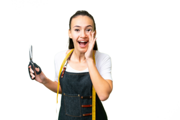 Young Seamstress woman over isolated chroma key background shouting with mouth wide open