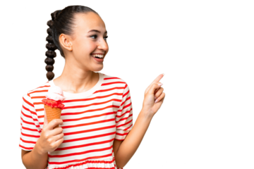 Young Arab woman with a cornet ice cream over isolated background pointing finger to the side and presenting a product