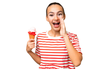Young Arab woman with a cornet ice cream over isolated background shouting with mouth wide open