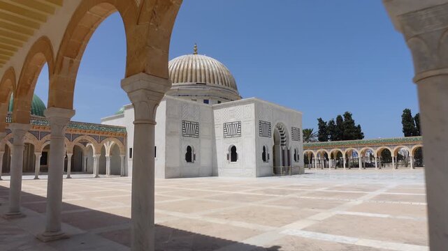 Walking through arches towards the beautiful Mausoleum of Habib Bourguiba, the first leader of Tunisia after the country gained independence from France
