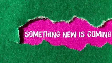Something new is coming message writing on ripped torn paper background