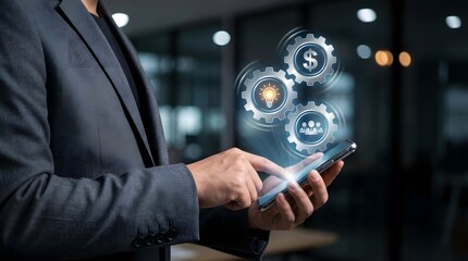 Businessman holding smartphone with holographic gears showing dollar, lightbulb, and team icons. Concept for fintech innovation, business strategy, financial growth, and teamwork synergy.